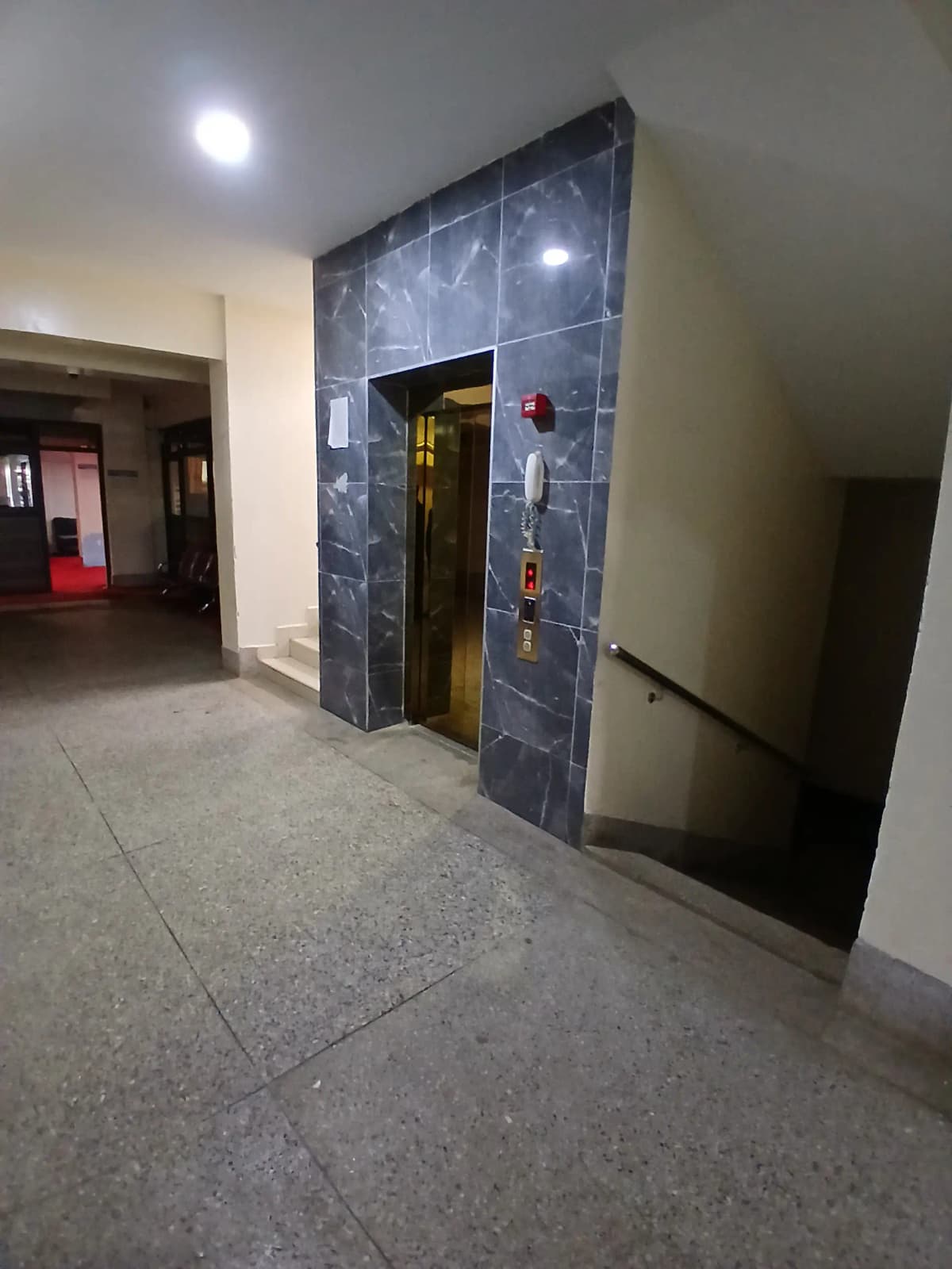 Building lobby with elevator and polished concrete flooring