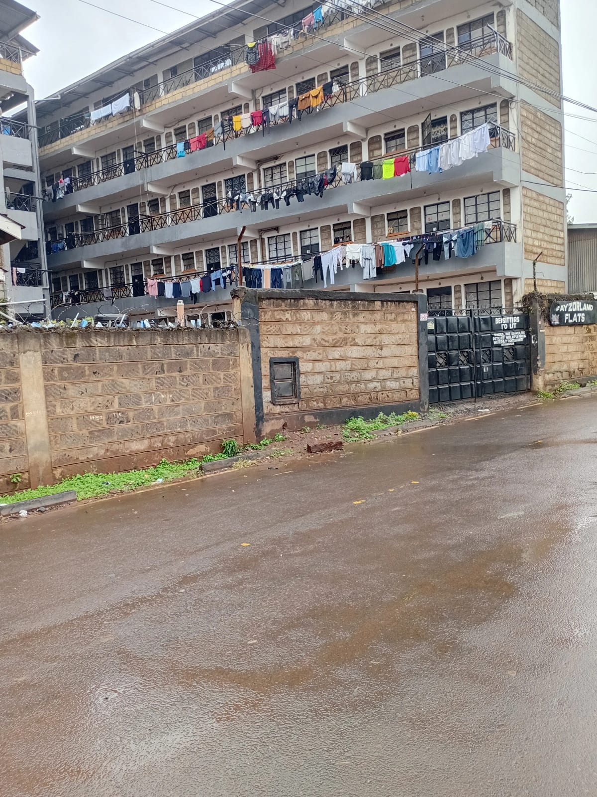 Multi-story residential building facade with laundry lines