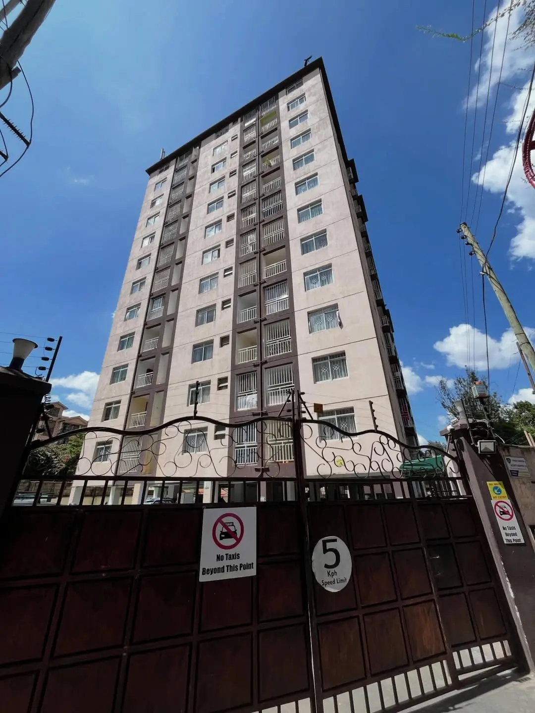Multi-story residential building facade with decorative balconies