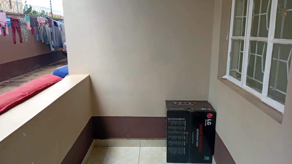 Compact laundry room with heating unit and clothesline access