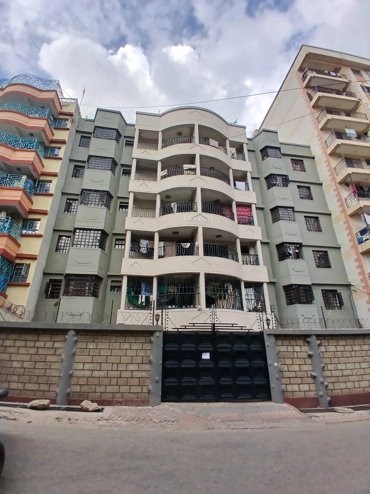 Multi-story residential apartment building with curved balconies
