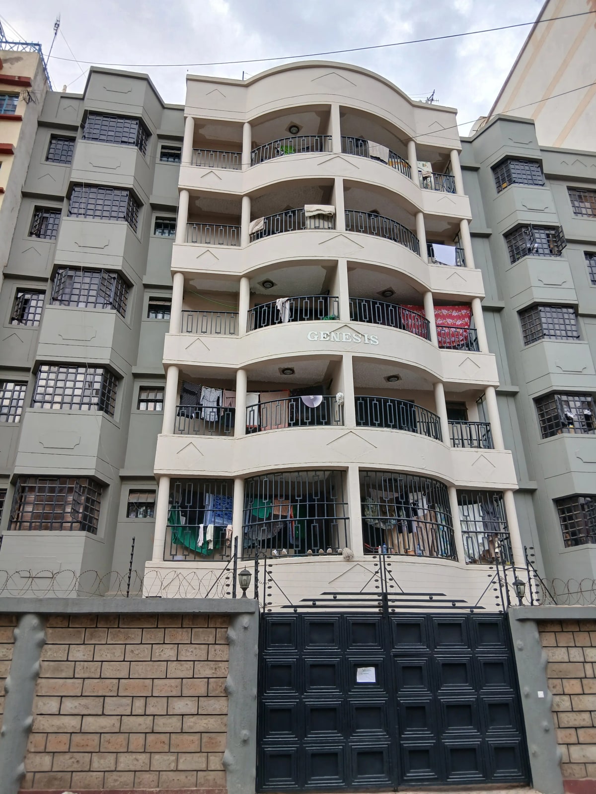 Multi-story residential apartment building with curved balconies