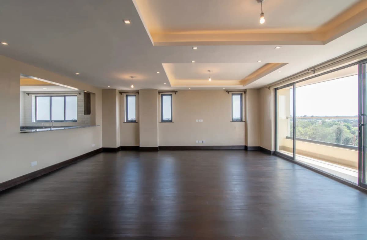 Spacious living room with dark wood floors and panoramic windows