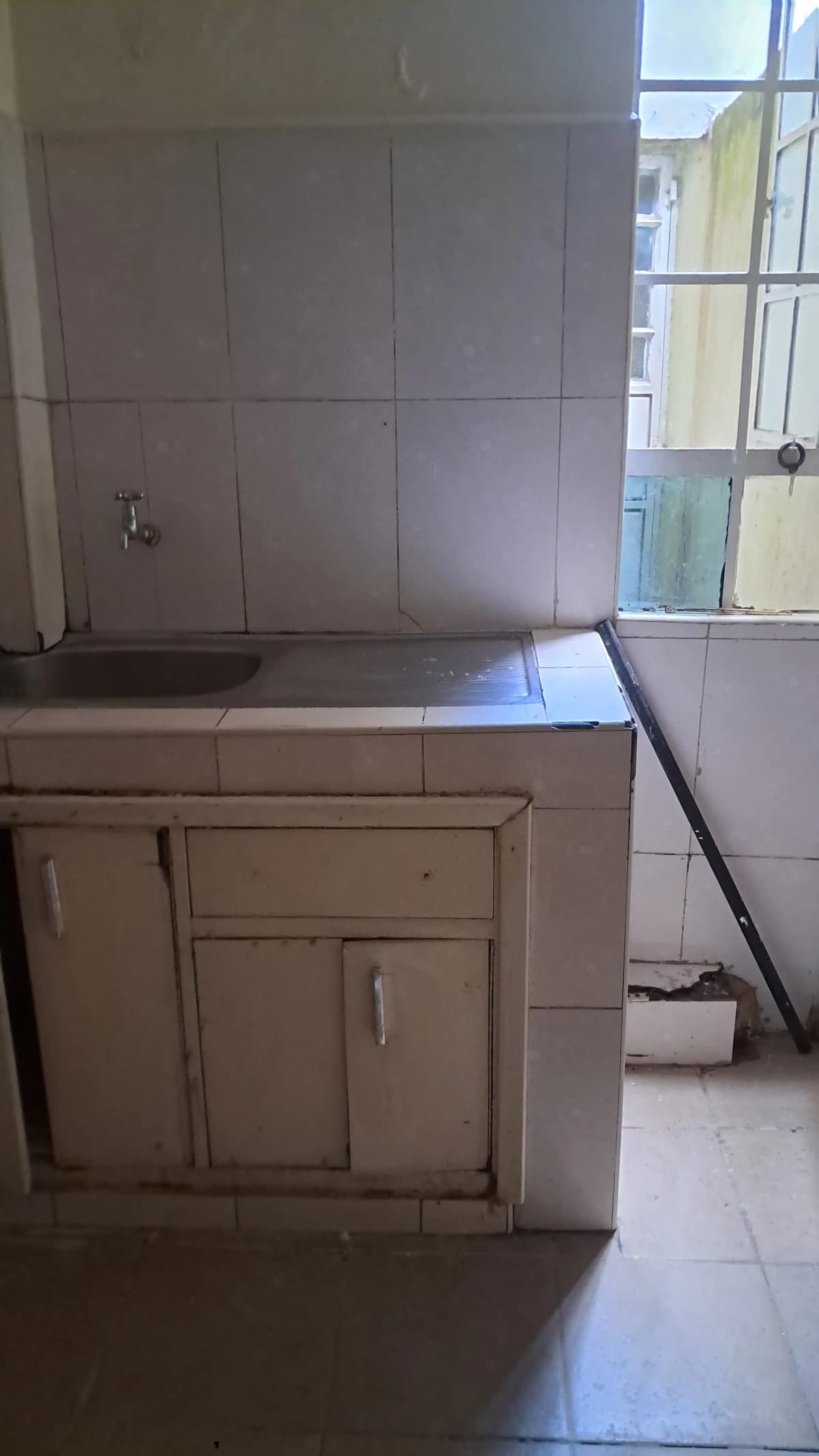 Bathroom with vanity sink cabinet and tiled walls