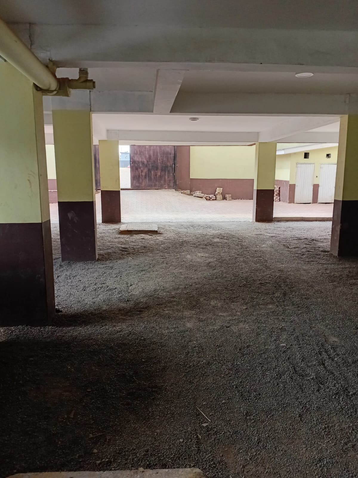 Underground parking basement with supporting columns and concrete floor