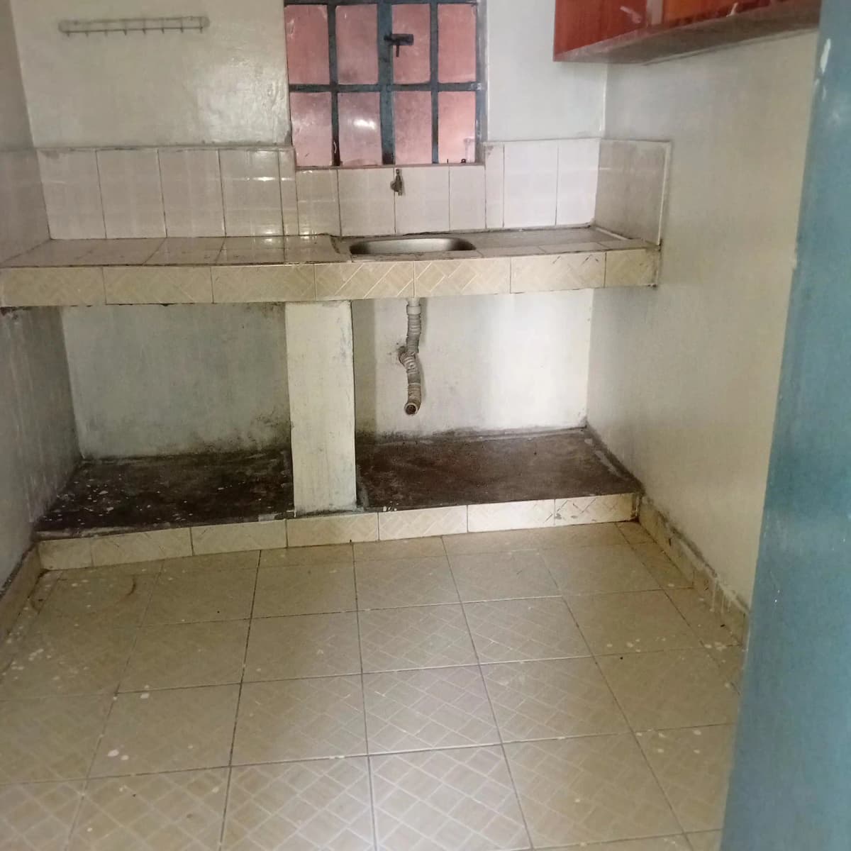 Basic kitchen with tile countertop and stove area