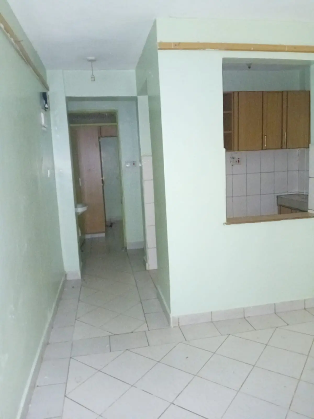 Hallway with view into open-plan kitchen area