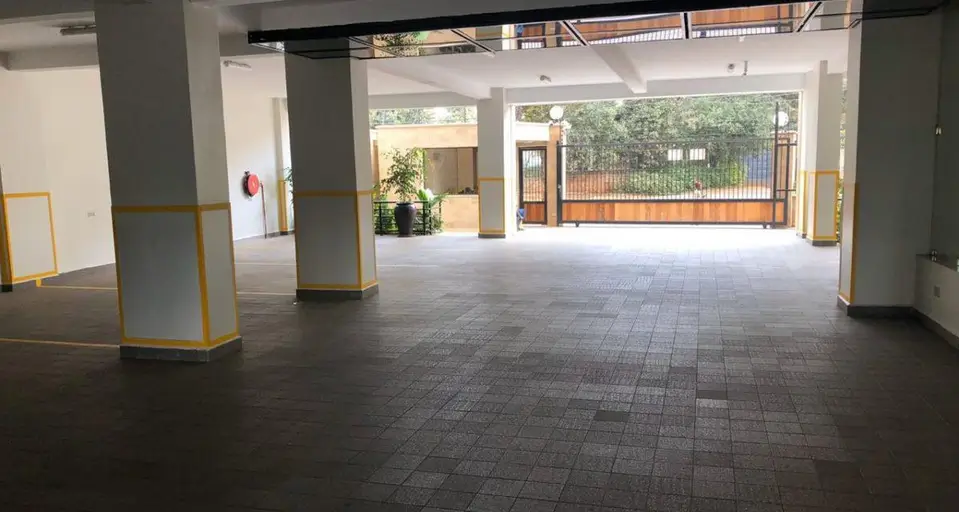 Spacious ground floor lobby with support columns and natural light