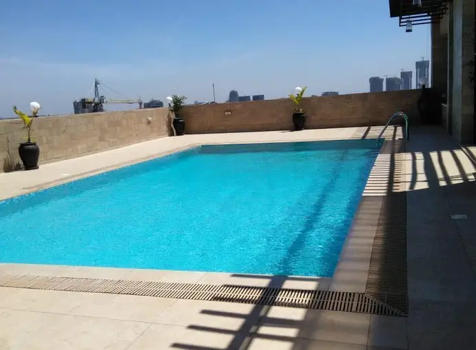 Rooftop swimming pool with city skyline views