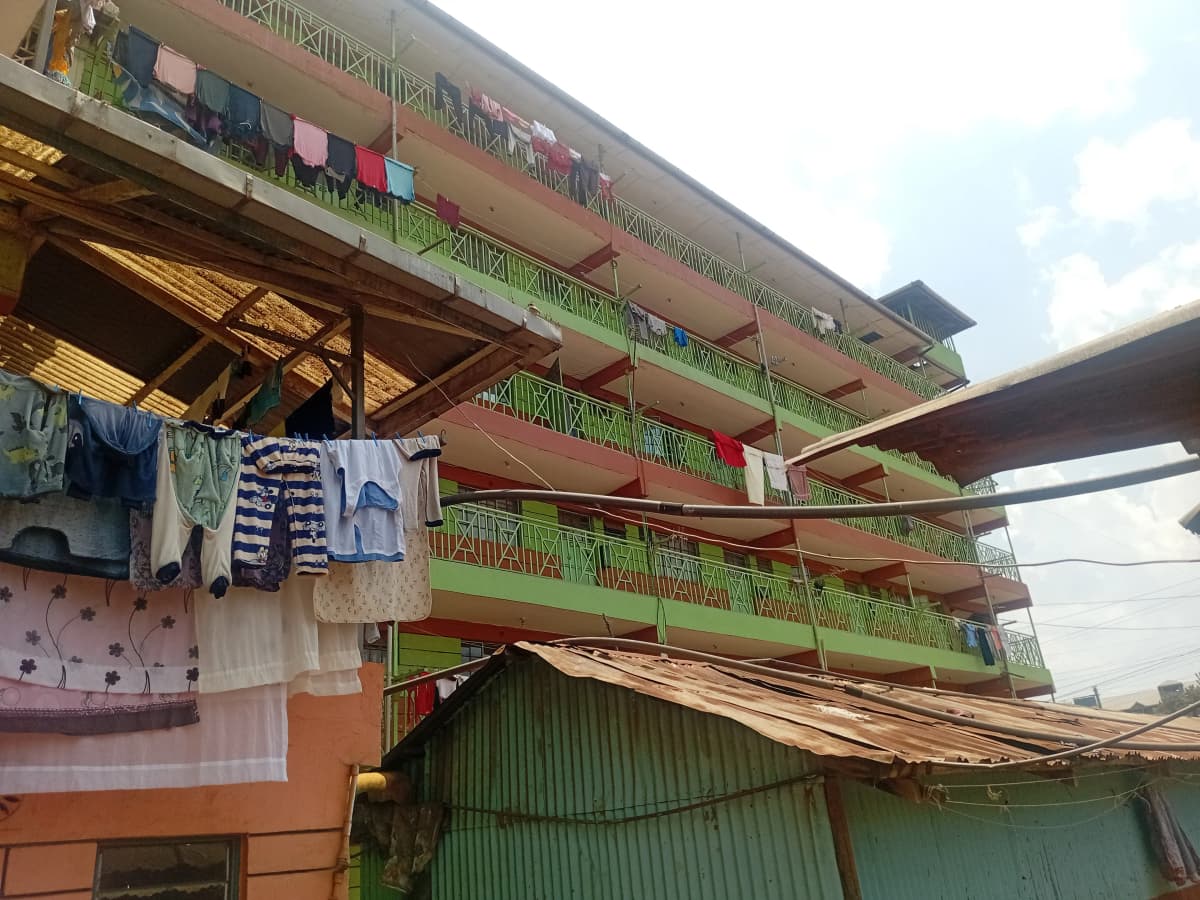 Multi-story residential building facade with laundry drying
