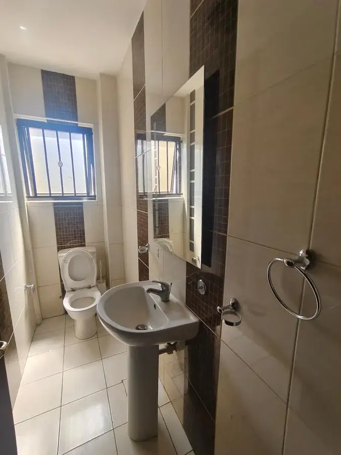 Modern bathroom with pedestal sink and toilet fixture
