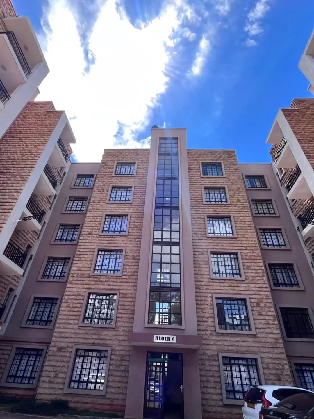 Multi-story residential building facade with brick construction