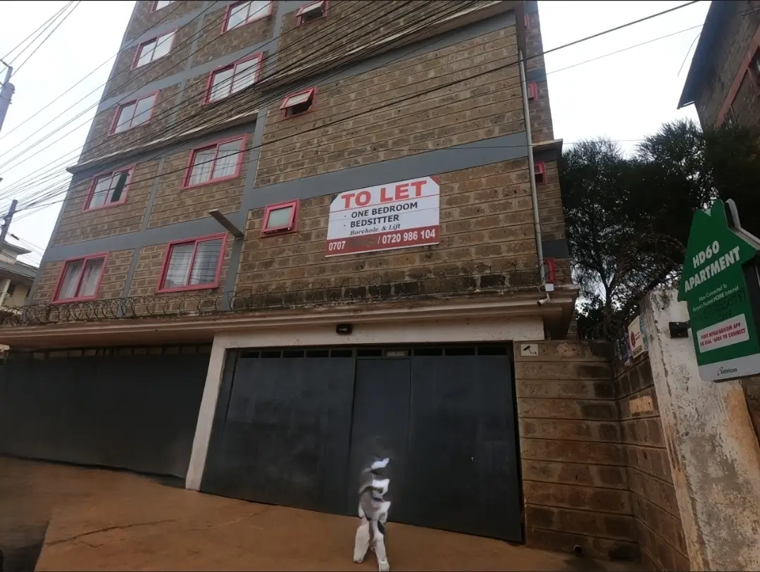 Multi-story brick building facade with TO LET signage