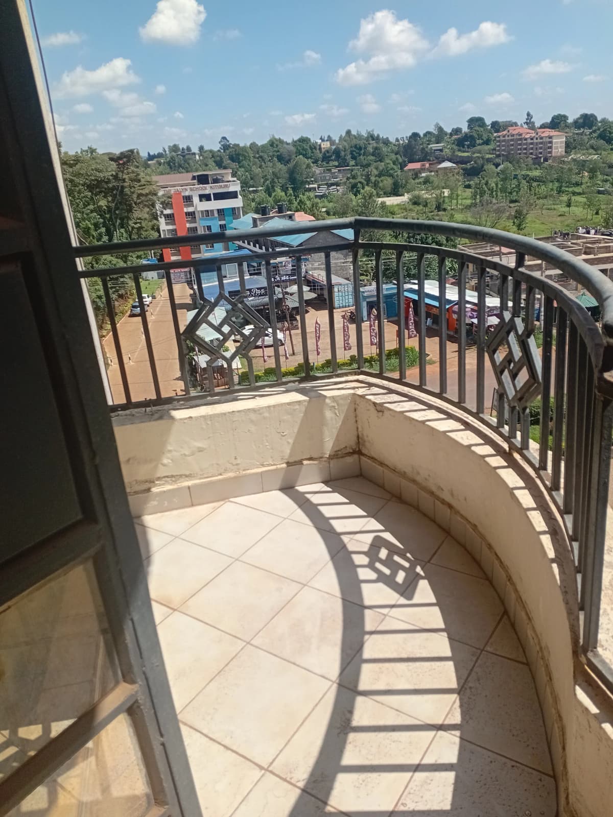 Curved balcony with panoramic suburban landscape views