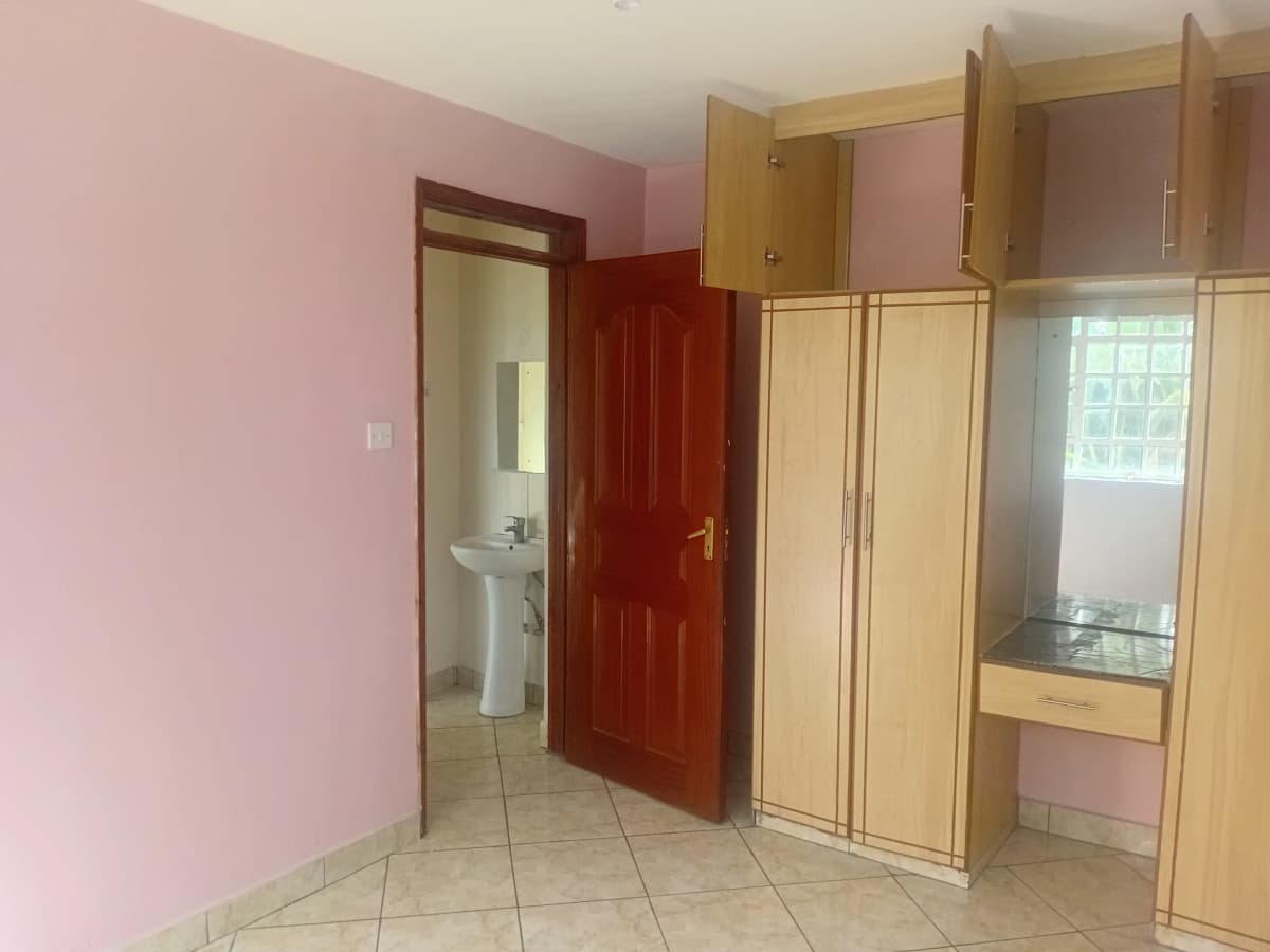 Bedroom with built-in wardrobes and ensuite bathroom access