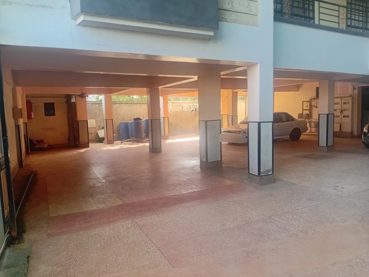 Large open lobby with support columns and terracotta flooring