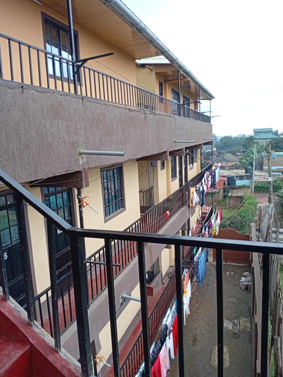 Multi-story residential building facade with metal railings