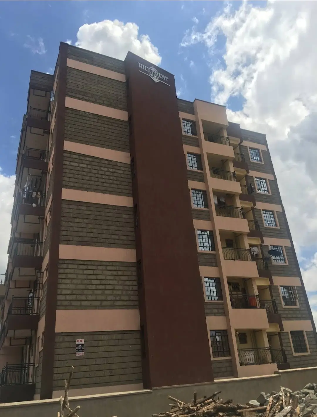 Modern multi-story residential building facade with mixed materials