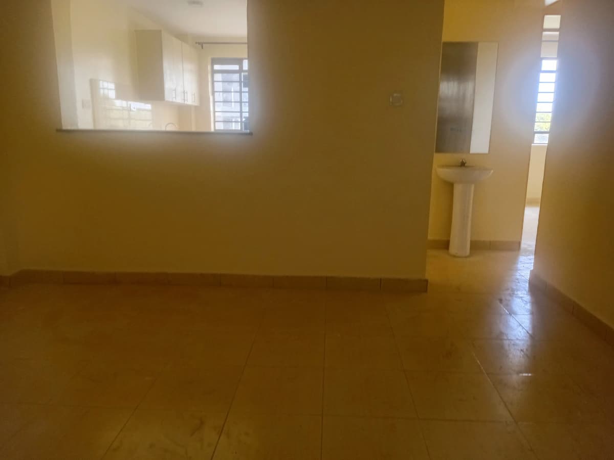 Spacious empty living room with polished concrete floor