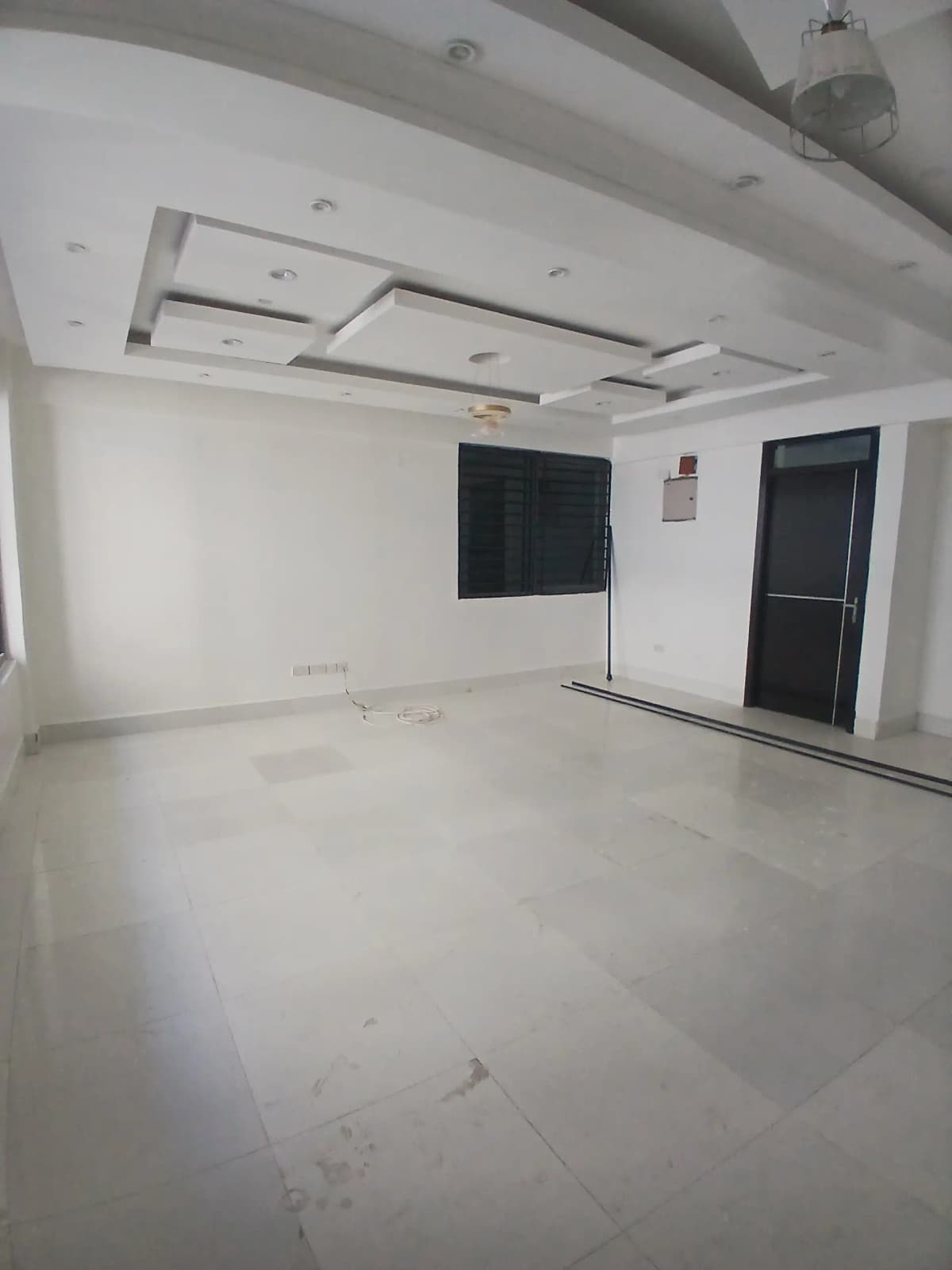 Spacious empty living room with modern ceiling design