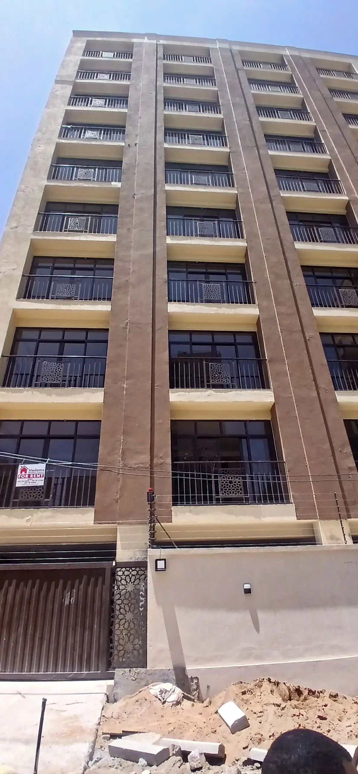 Multi-story residential building facade with balconies