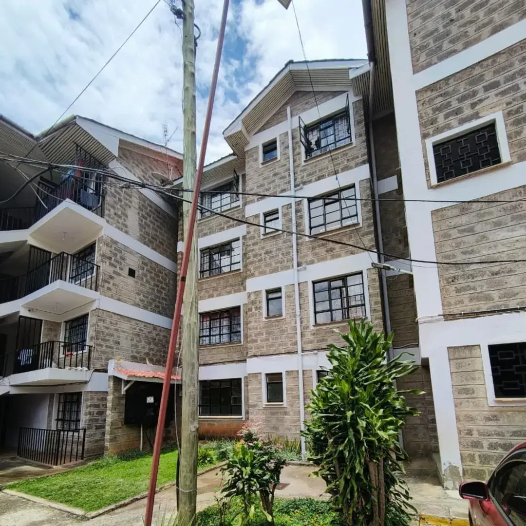 Multi-story residential building with brick facade and balconies