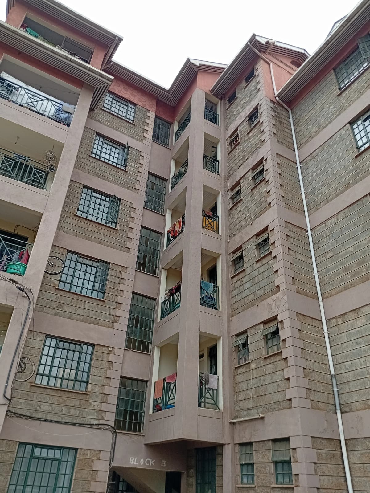 Multi-story residential building facade with regular window pattern