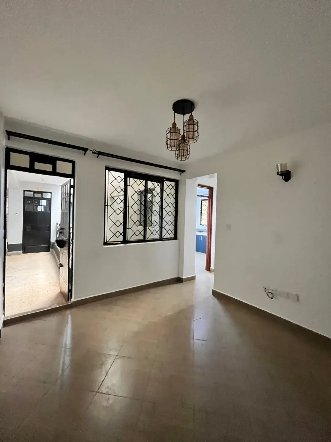 Spacious open living area with polished concrete flooring