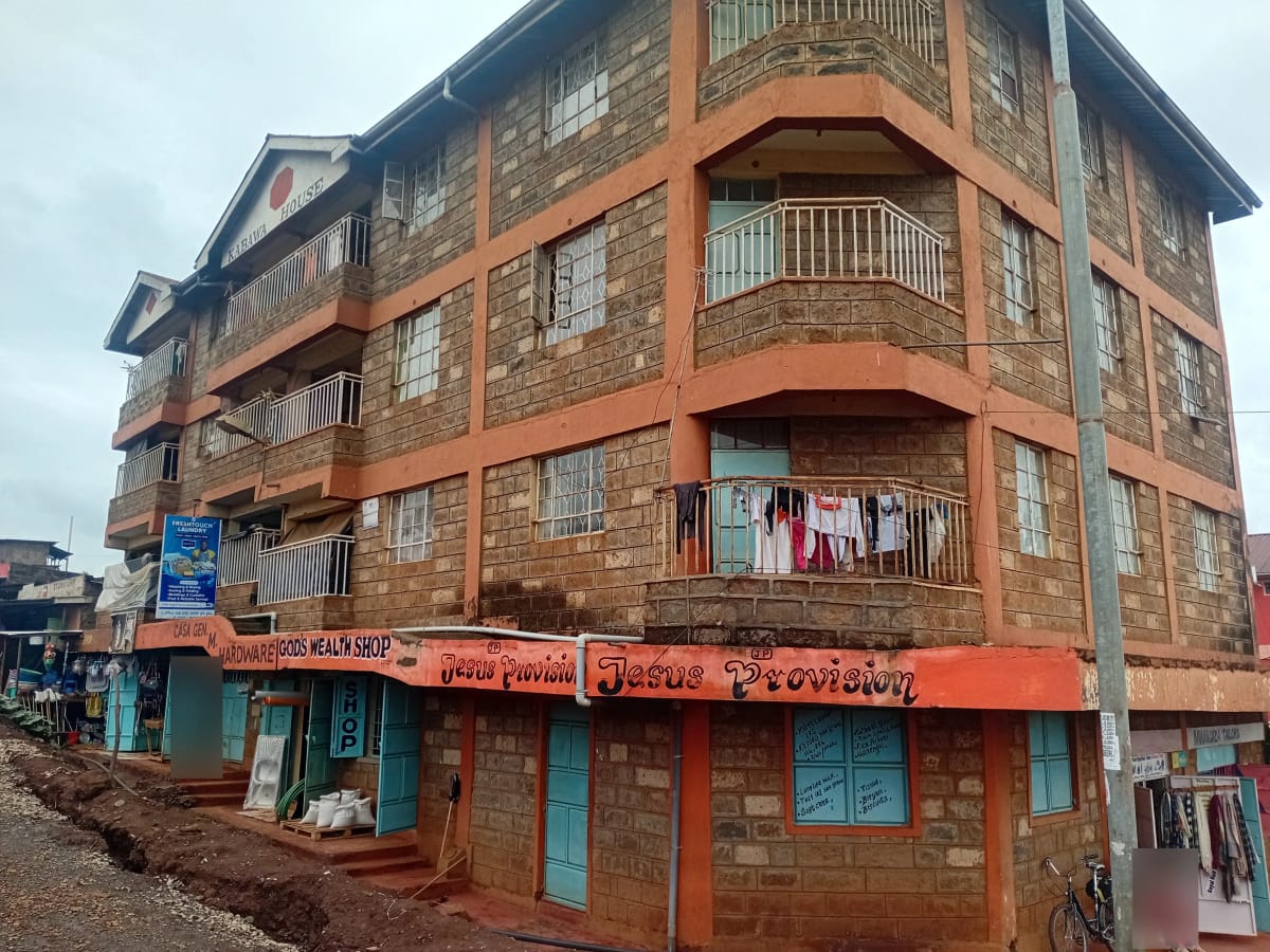Multi-story residential building with brick facade and balconies