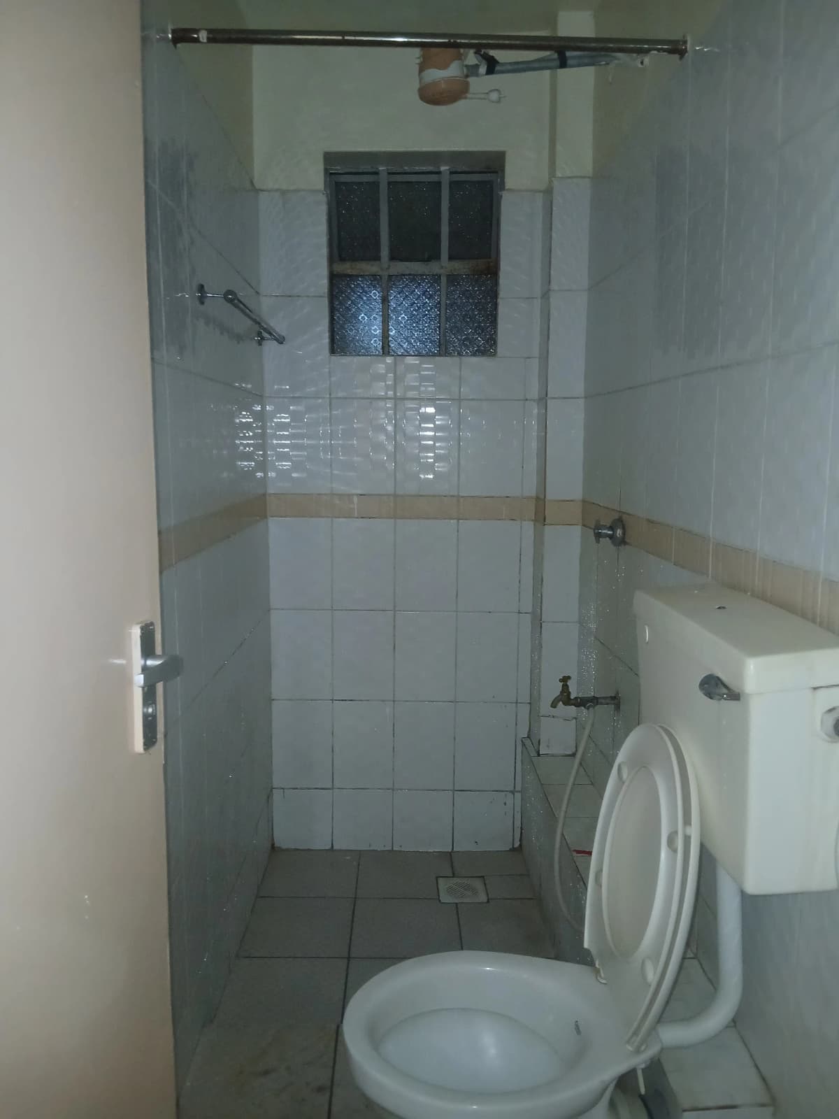 Modern bathroom with walk-in shower and white toilet