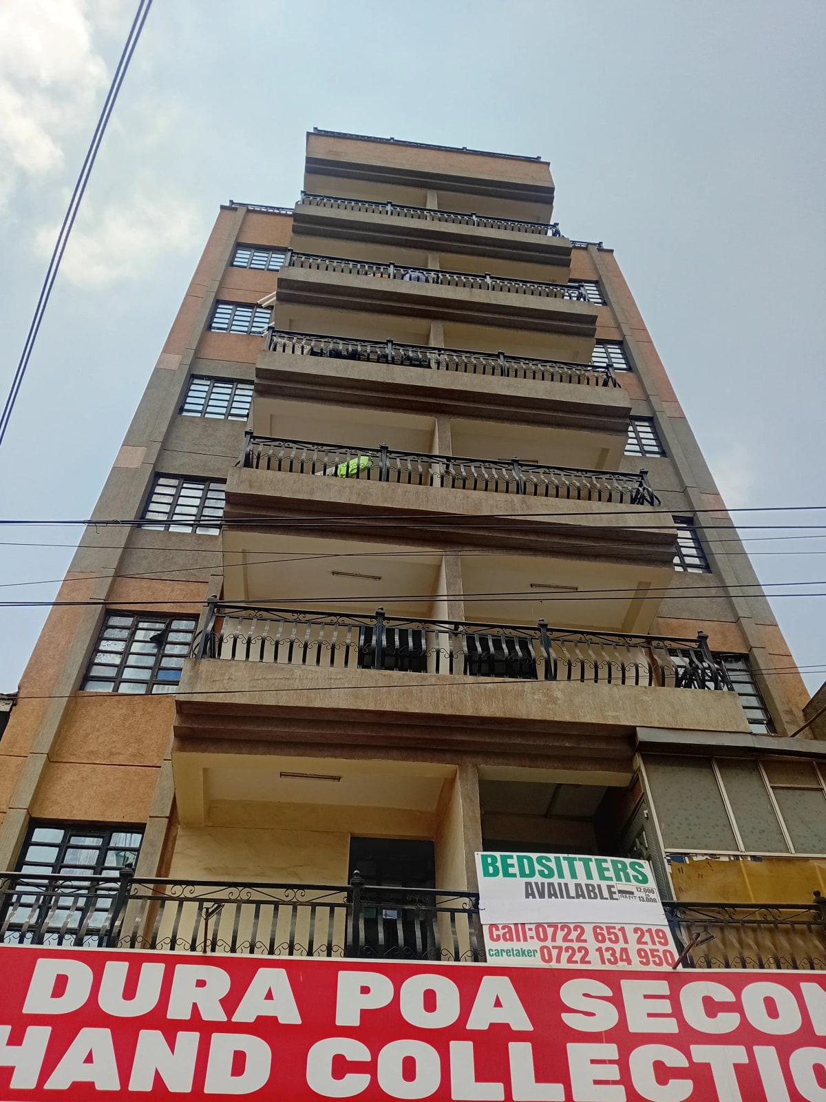 Mid-rise residential building facade with multiple balconies