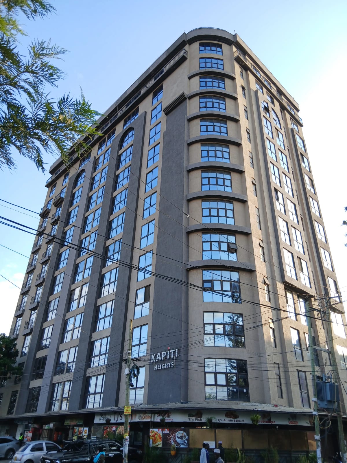 Modern multi-story residential building facade with street frontage
