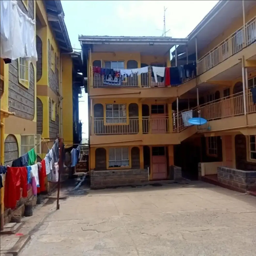 Multi-story residential compound with colorful facades and balconies