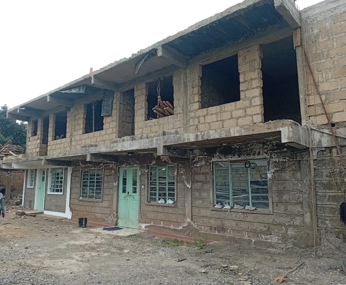 Unfinished concrete building facade with empty windows