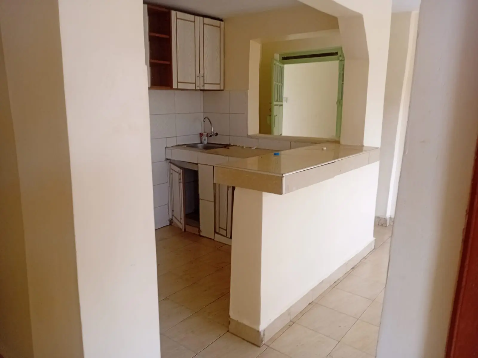 Open-plan kitchen with breakfast bar and adjacent dining space