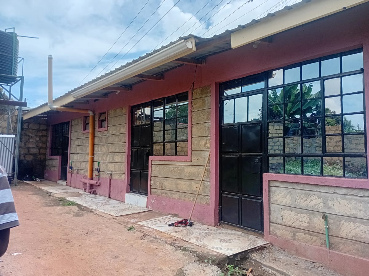 Commercial storefront with red facade and large windows