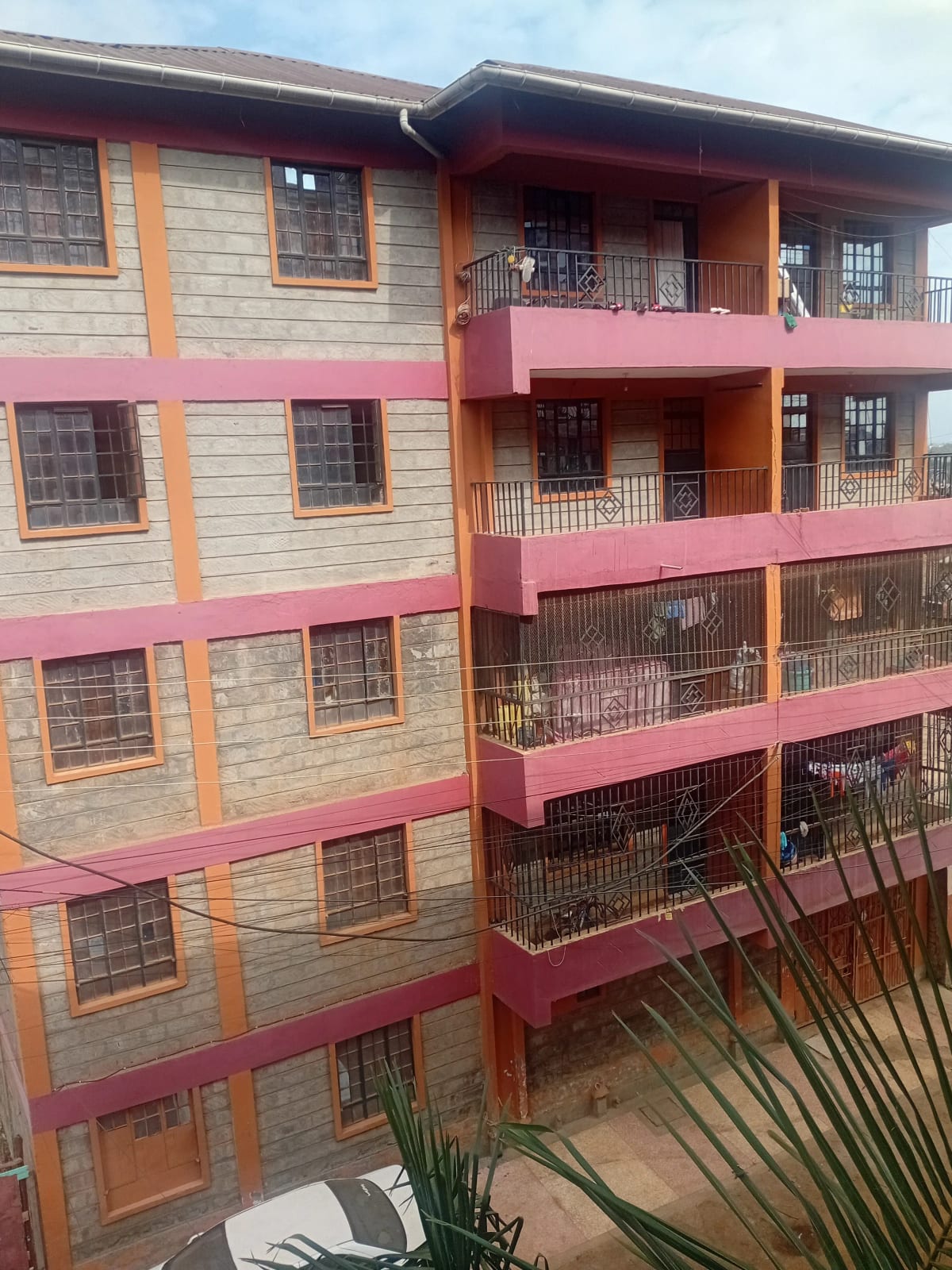 Multi-story residential building with colorful facade and balconies