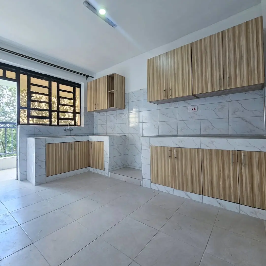 Modern kitchen with wood cabinetry, marble backtile, stainless steel sink