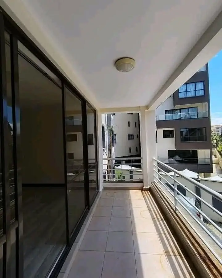 Modern balcony with sliding doors and city views