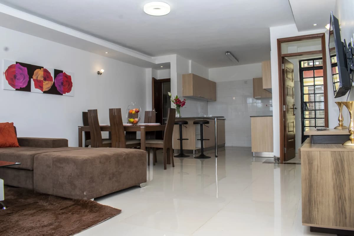 Open-plan living room with dining area and kitchen visible