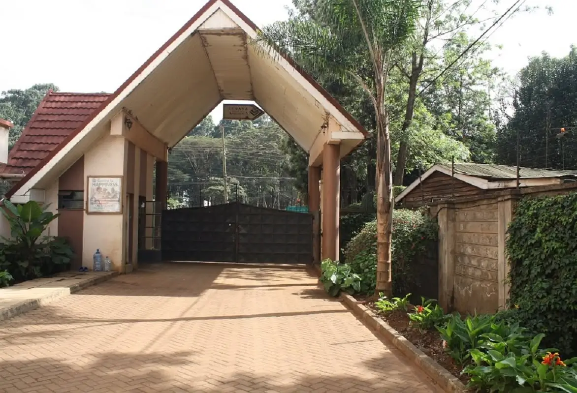 Gated driveway with covered parking carport entrance