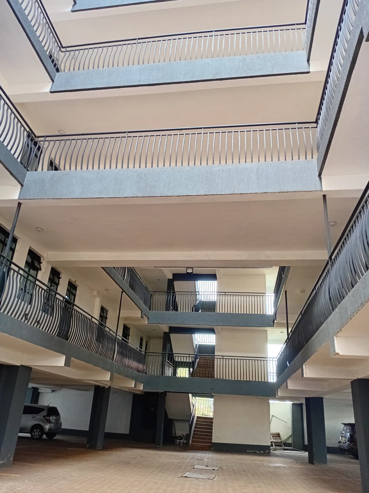 Multi-level building lobby with skylight and metal railings