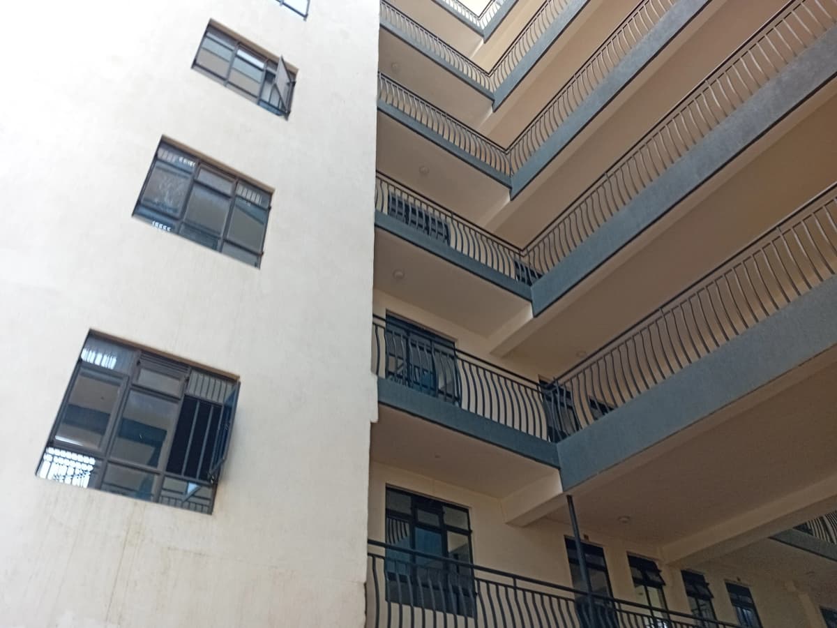 Multi-story interior courtyard with tiered balconies and railings
