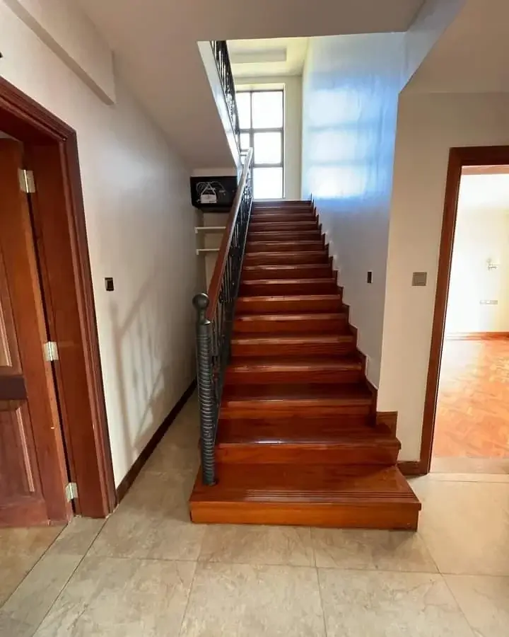 Interior staircase with wooden steps and natural light entry