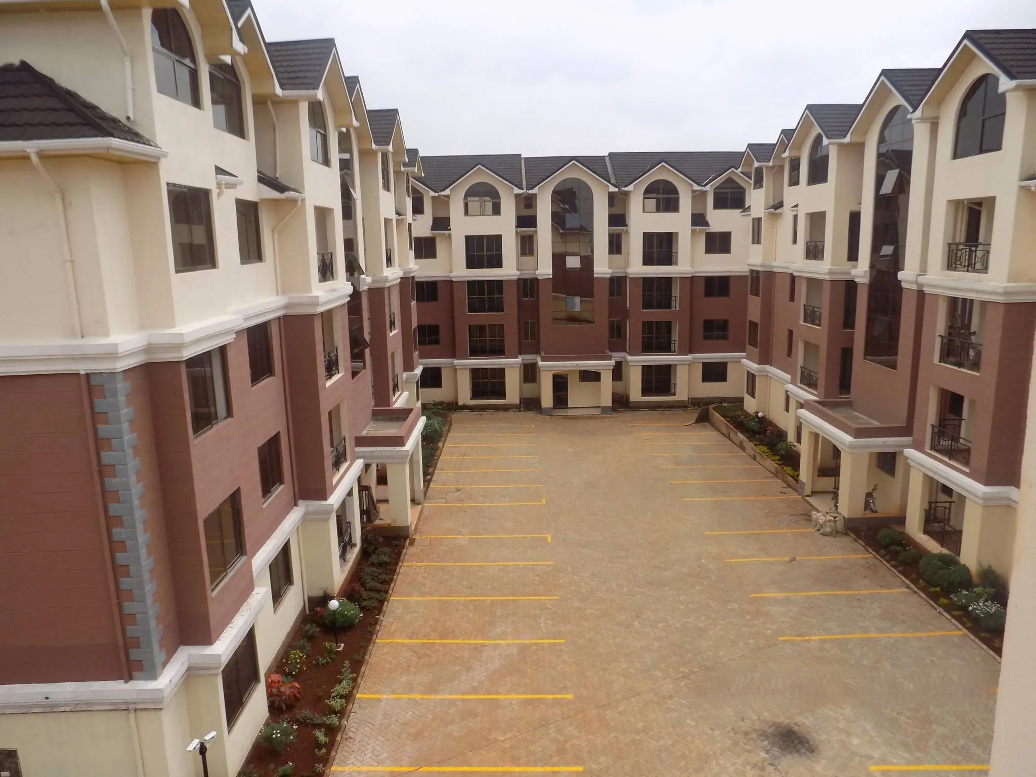 Residential compound parking area with yellow markings