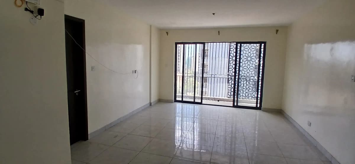 Spacious bright living room with large barred windows
