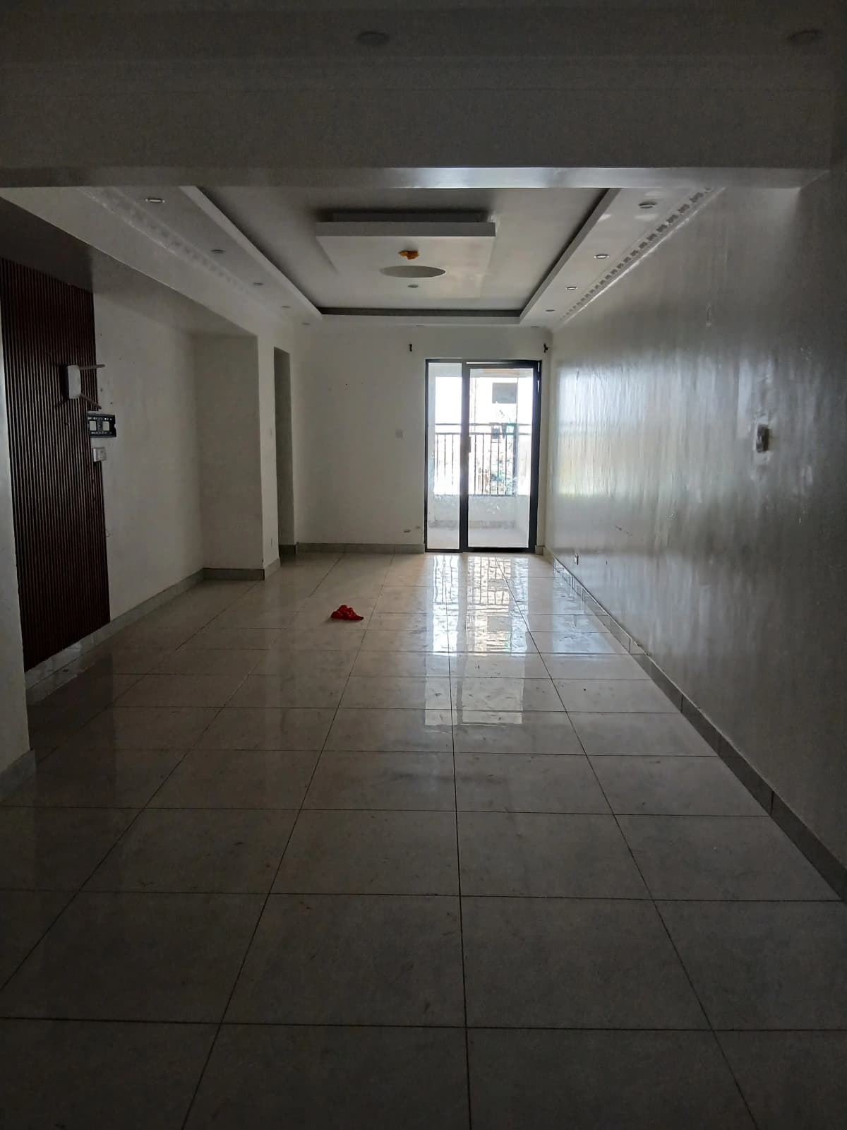Spacious building lobby with polished tile flooring
