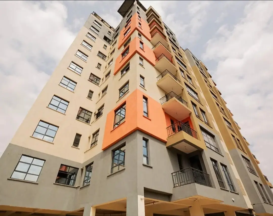 Multi-story residential building with orange and cream facade