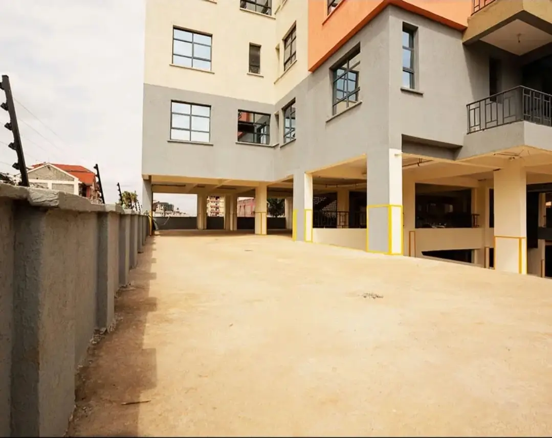 Ground floor parking area with covered spaces