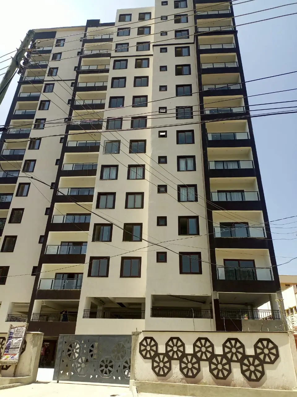 Modern multi-story residential building facade with balconies